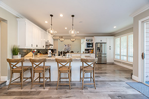 Open floor plan kitchen displaying a coastal style as designed by expert New Jersey builders